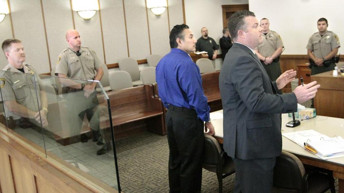 Former Pasco police officer Richard J. Aguirre, left, stands with his then-attorney Scott Johnson during a 2015 hearing in Franklin County Superior Court. In addition to the Spokane County case for first-degree murder, Aguirre has an unrelated Pasco case for third-degree rape and fourth-degree assault.