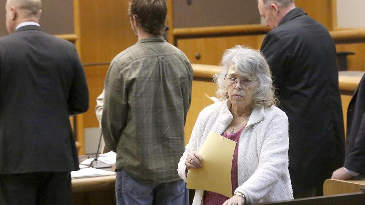 Sherry L. Dress of John Day, Ore., leaves Benton County Superior Court after being arraigned Wednesday morning for two counts of practicing as a midwife without a license.
