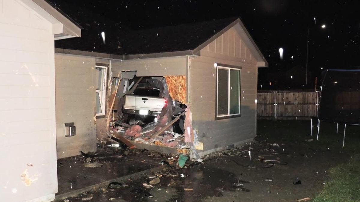 A Pasco man died after his truck went off the road and through a home near Convention Drive and Sandifur Parkway.