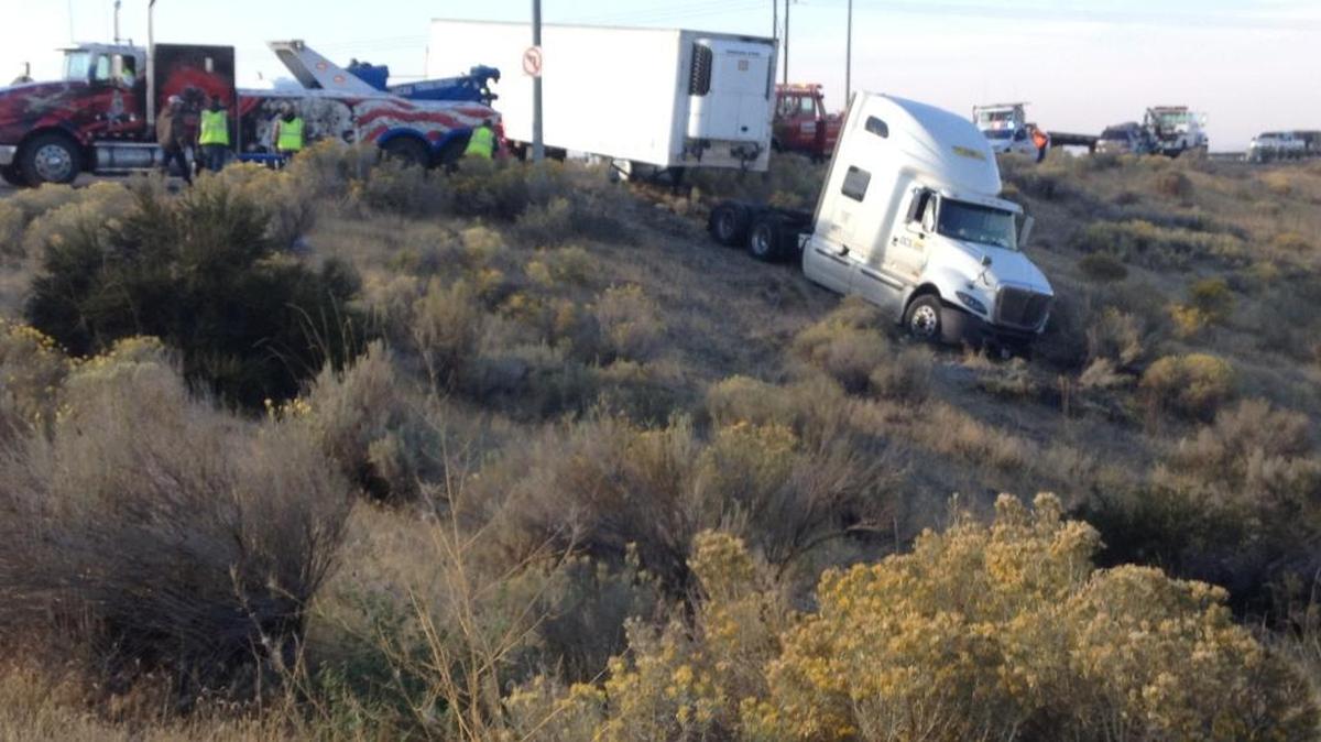 
A semi-truck and tractor hit a passenger car Tuesday morning after taking the exit ramp off Highway 12 toward Lewis Street in Pasco. The driver may have failed to stop at the stop sign, said investigators. Two people in the car were hurt and taken to a hospital to be checked.
