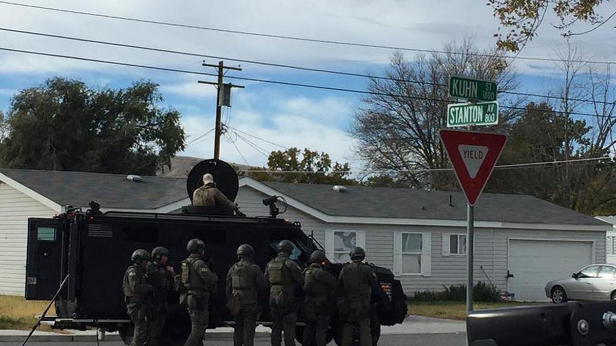 The Richland Police Department and the Tri-City Regional SWAT team surround the Richland home of a pair of burglary suspects Sunday morning. Two suspects were arrested on felony charges.