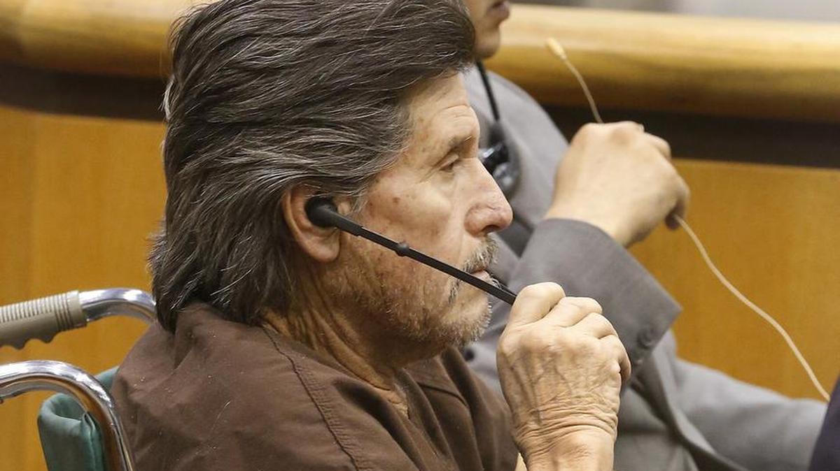 Lucio Reyes Perez listens to court interpreter Frank Rojas on Tuesday while in Benton County Superior Court for a competency hearing in the June shooting of Guillermo Salas-Lozano, 34, outside a Whitstran market.