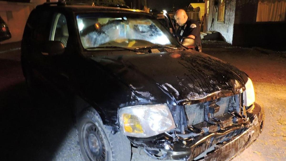 Pasco police caught up with the person driving this SUV after it plowed into the back of a parked GMC.