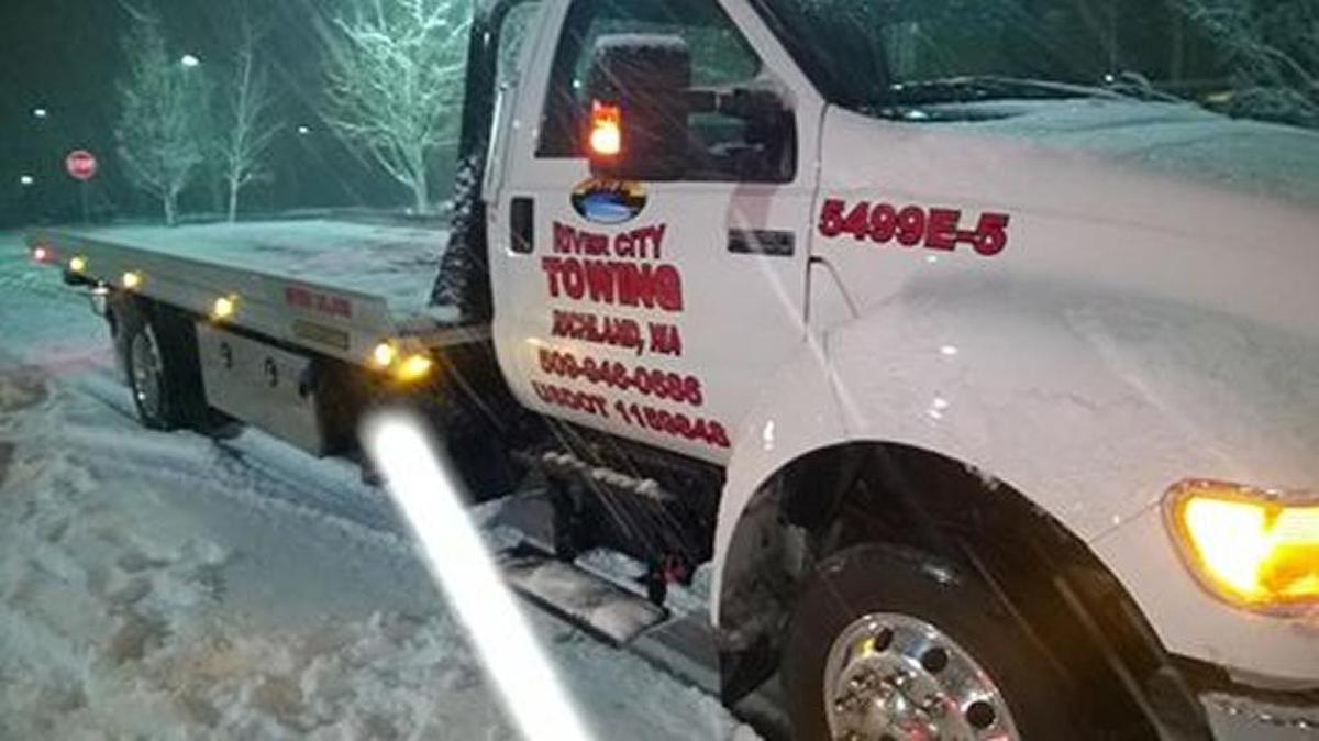 A tow truck driver suffered minor injuries Sunday night when he was hit by another vehicle while working at a collision scene in West Richland.