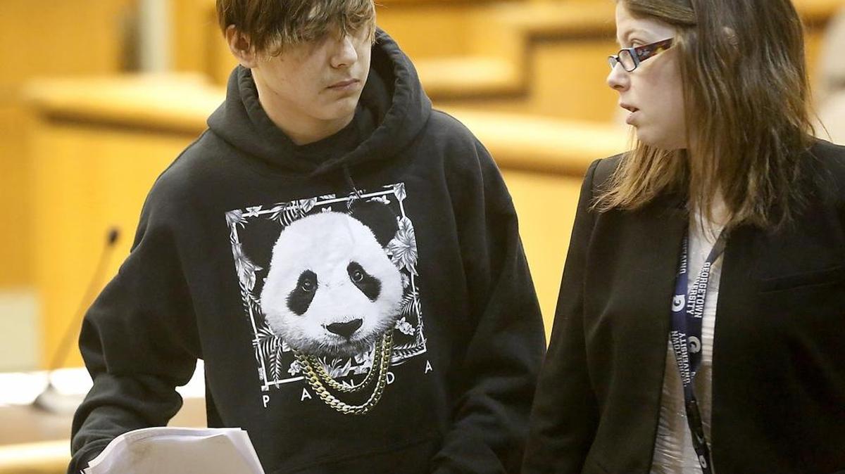 Ezekiel I. Salazar, 16, walks with his juvenile defense attorney, Alexis Rado, during arraignment Wednesday in Benton County Superior Court for the Dec. 18 home invasion in east Kennewick that involved victim Laura Dunbar.