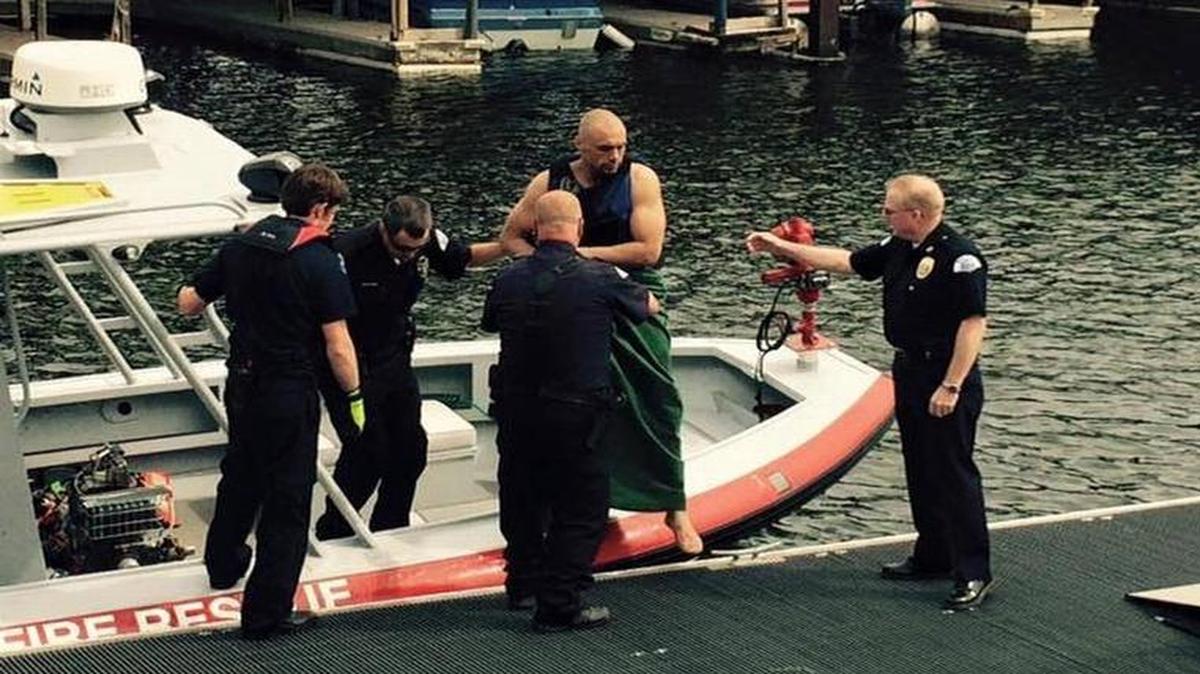 Law enforcement and fire officials help Aaron J. Hogan off a rescue boat after pulling him from the Snake River on May 23, 2016. Hogan had been fleeing police since the day before, and was wanted for two assaults, a robbery, a burglary and two stolen vehicles, along with a warrant.