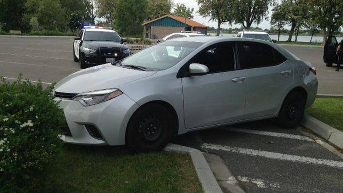 Kennewick police found a man passed out behind the wheel of this car Wednesday afternoon at Columbia Park. Two young children were in the car at the time it crashed into a landscaping island.