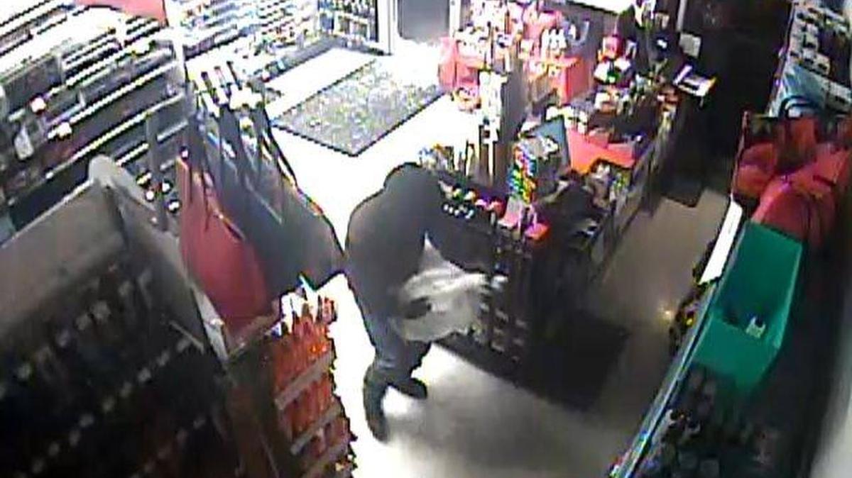 A suspect steals things from Sally Beauty World on West Canal Drive on Tuesday.