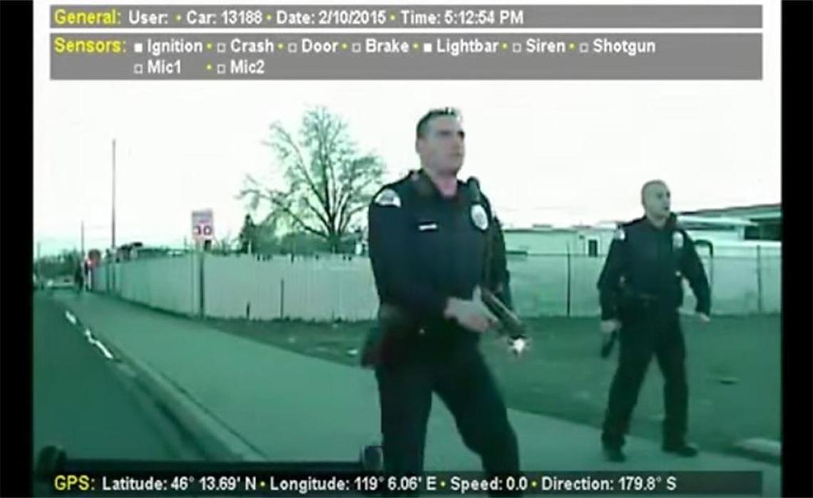 A still frame from Pasco Police Department dashcam video shows officers approaching Antonio Zambrano-Montes on Feb. 10, 2015, at the busy downtown intersection.