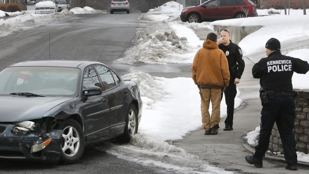 Kennewick police Sgt. Matt Newton performs a field sobriety test on David Rae of Connell after he was involved in a two-car collision Jan. 25 on Canal Drive in Kennewick. He has pleaded innocent to vehicular assault. Investigators claim his blood-alcohol level was almost three times above the legal limit to drive.