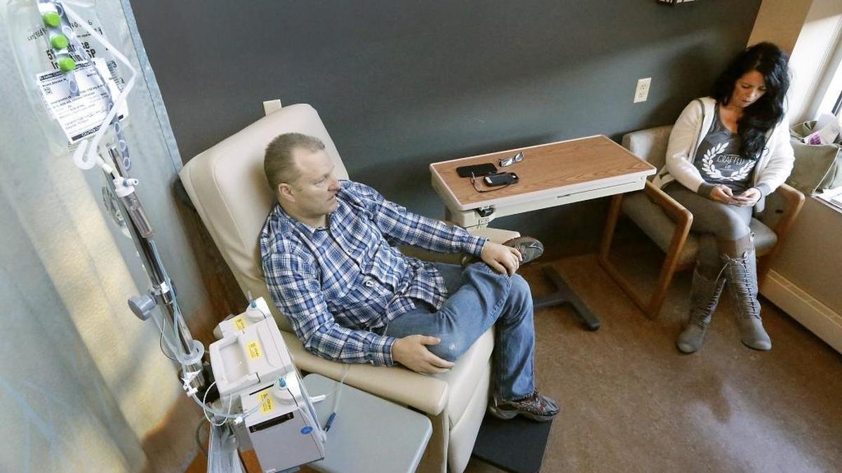 Benton County Sheriff Steve Keane sits with his wife, Diane, recently at the Tri-Cities Cancer Center receiving his seventh chemotherapy treatment for stage 3 prostate cancer. The 53-year-old was diagnosed with cancer on Aug.6, after a colonoscopy, and had surgery to remove part of his colon on Aug. 21.