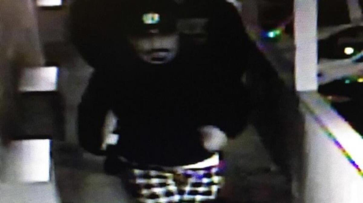 Kennewick police are searching for these three men who robbed a woman who stopped at a motel for the night.