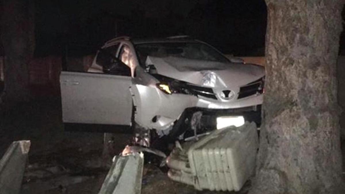 The driver of this passenger car was taken to the hospital with minor injuries Wednesday night after hitting this tree and damaging an electrical power box.