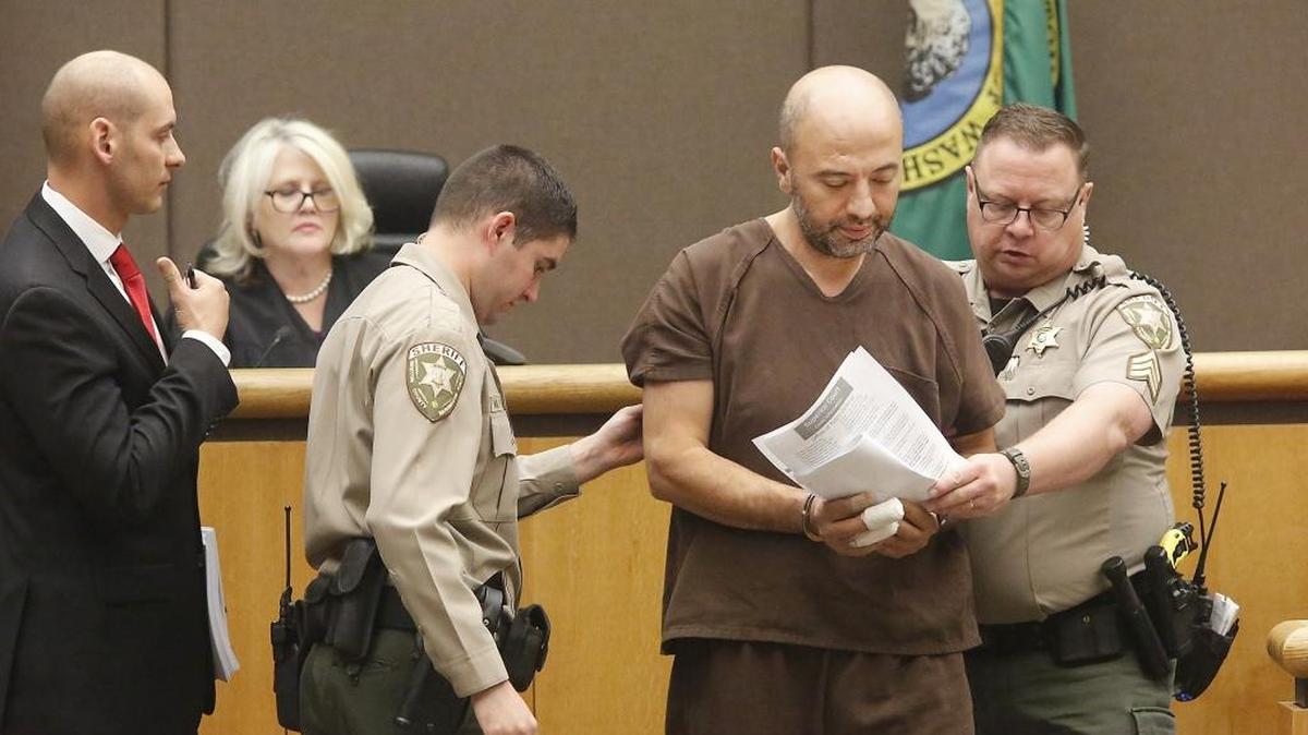 Benton County corrections officers escort Abdul Rahman Sweidan out of Benton County Superior Court on Wednesday after he kept interrupting Judge Jackie Shea Brown and a court interpreter. The Kennewick man was scheduled to enter a plea to attempted second-degree murder and first-degree assault charges after he allegedly stabbed his wife 20 times in front of their toddler. Caleb DiPeso, left, was his provisional defense attorney. The hearing will be rescheduled.