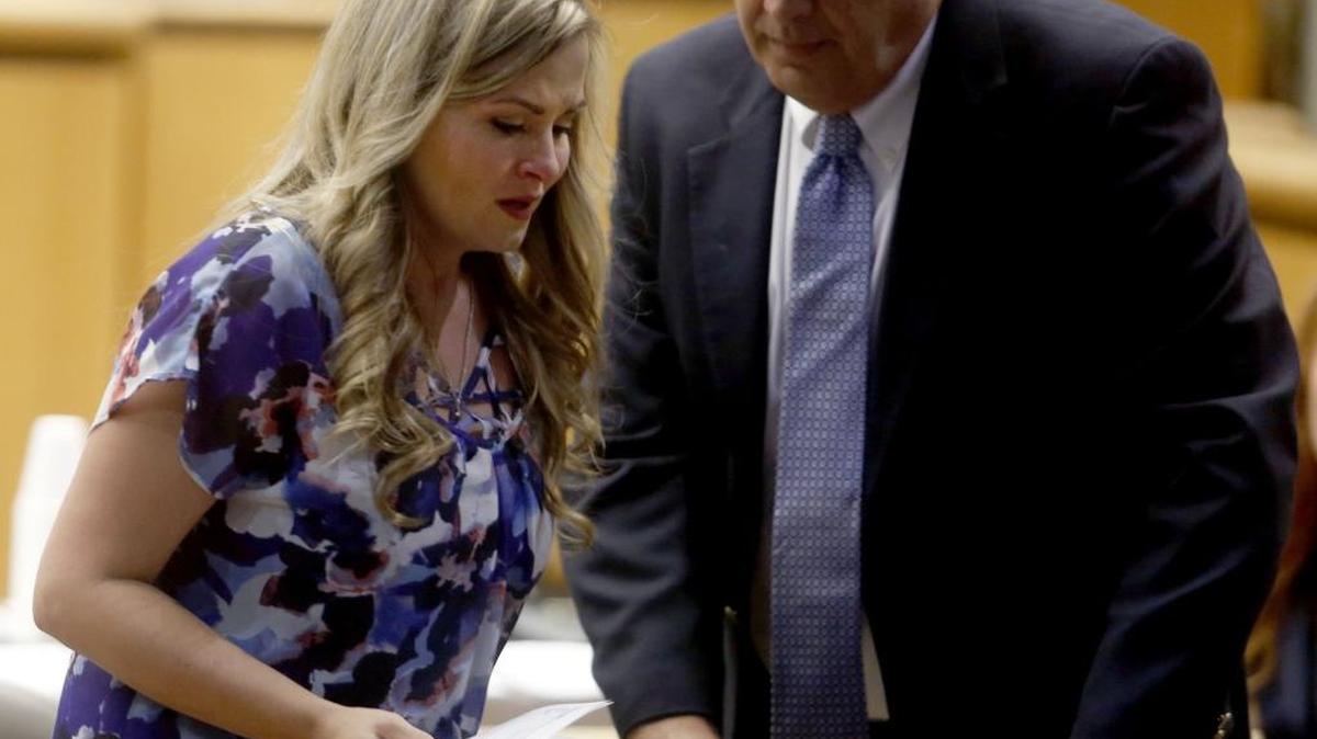 
Tawney Johnson, mother of toddler Ryer Morrison, is helped back to her seat by Benton County Prosecutor Andy Miller Thursday at the Benton County Courthouse during the sentencing of Kelli A. Jacobsen. Jacobsen was sentenced to 4 1/2 years in prison for the 2011 death of Morrison. See a video at www.tricityherald.com.
