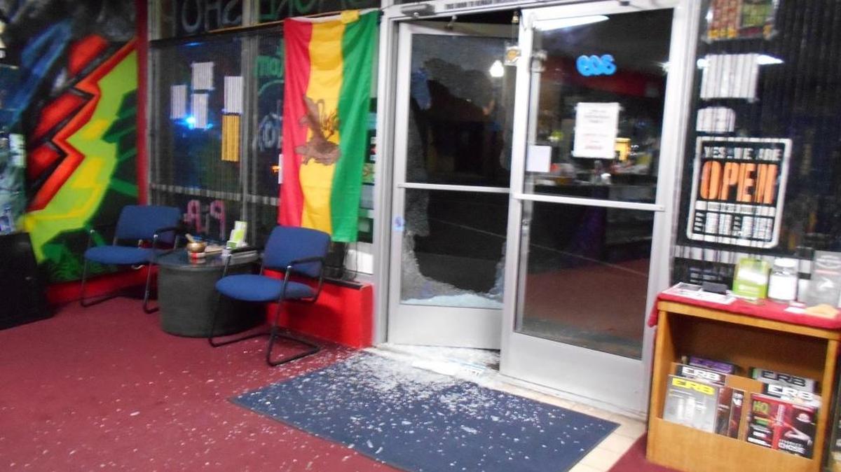 Security video showed two teen boys shattering glass on the front door of Da Kind Shop before they went inside. The boys appeared to be in their early teens.