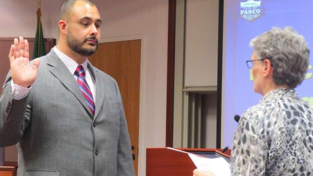 Chi Flores takes the oath of office in November to become a Pasco city councilman.