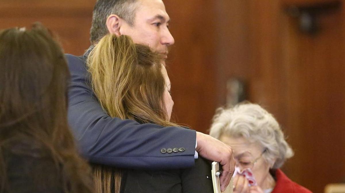 Former Pasco police officer Richard J. Aguirre is surrounded by supportive and emotional family members Thursday after a Franklin County Superior Court jury found him innocent of raping and assaulting a woman in 2014.