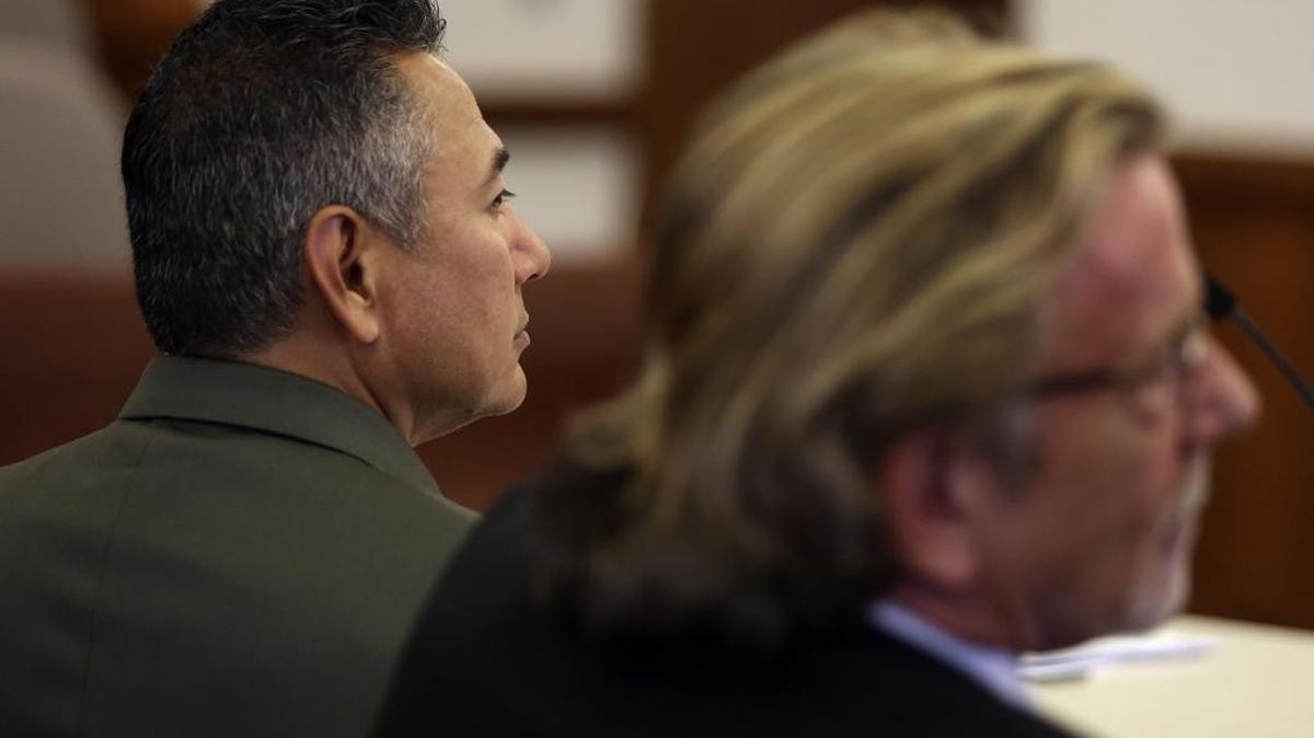 Richard J. Aguirre, left, sits with defense attorney John Henry Browne during a hearing in Franklin County Superior Court.