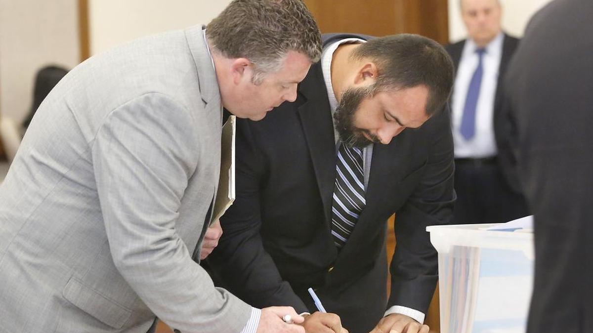 Chi Flores, right, and his lawyer Scott Johnson have filed a motion to dismiss the Pasco councilman’s child sex case. His trial is Nov. 15 in Franklin County Superior Court.