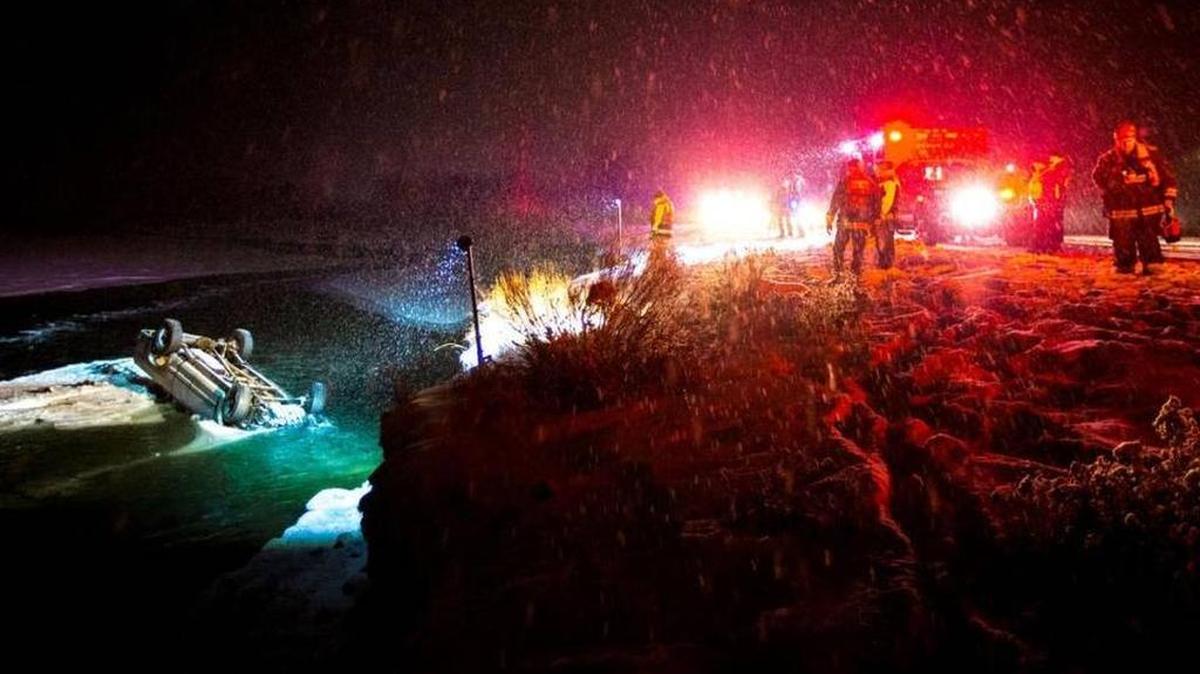 Emergency crews work to recover the bodies of two Prosser men killed in January when one lost control of the vehicle he was driving eastbound on Highway 12 near Naches.