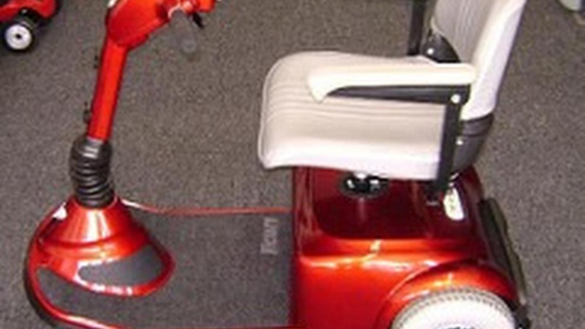 Fred’s red Pride scooter