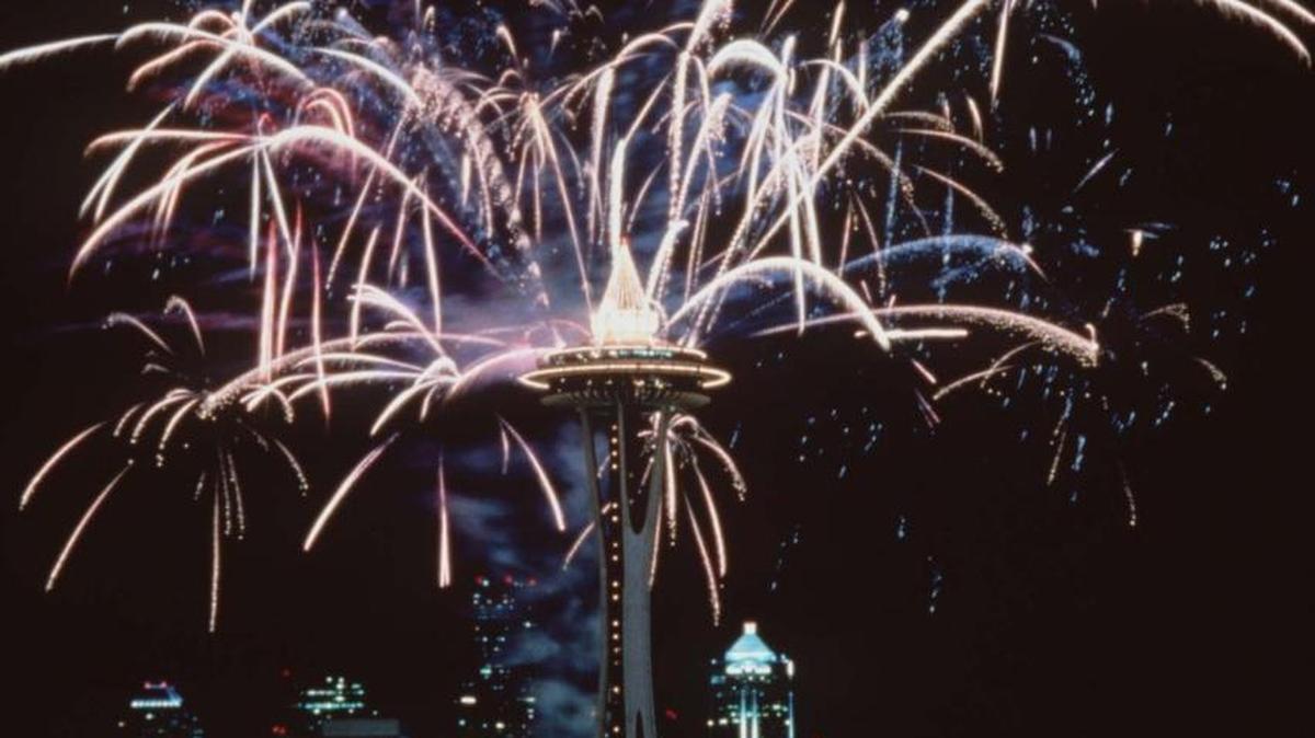 File photo via The Olympian shows fireworks surrounding the Space Needle in Seattle, Wash.
