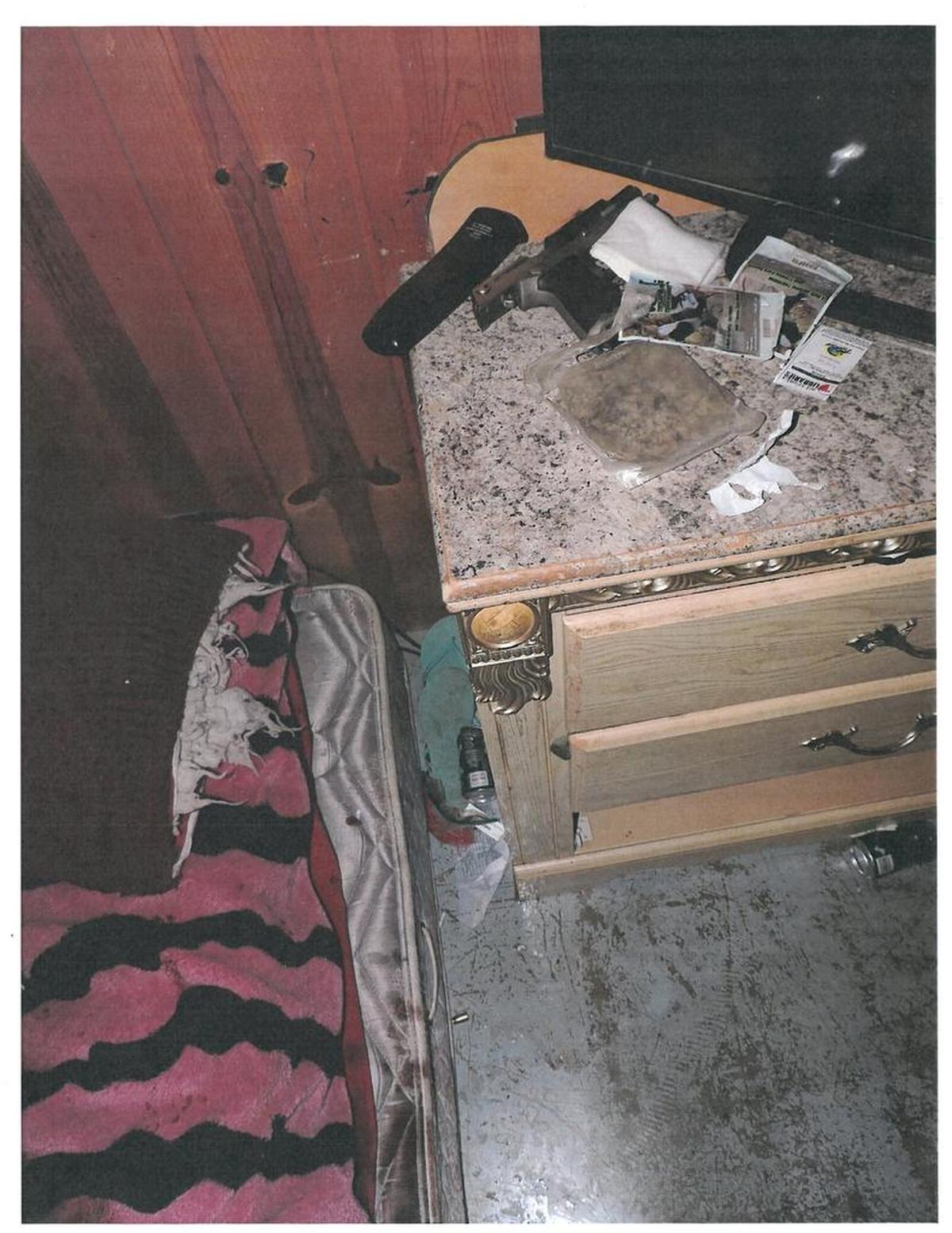 This dresser is next to the bed where Edwin Espejo was sitting when Pasco police arrived late Sept. 16. Espejo’s Ruger P90DC pistol is at the top of the photo, with the slide locked back on an empty magazine.