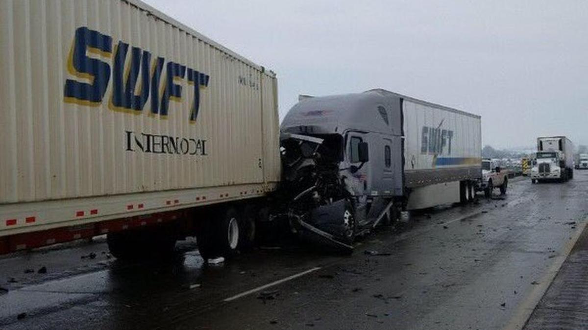 Three semi trucks and a car collided on Interstate 82 on Wednesday morning.