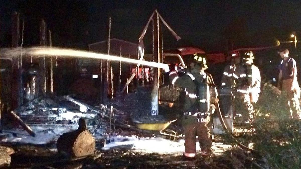 Kennewick police say a woman admitted to smoking and drinking in a large shed, accidentally starting a fire.