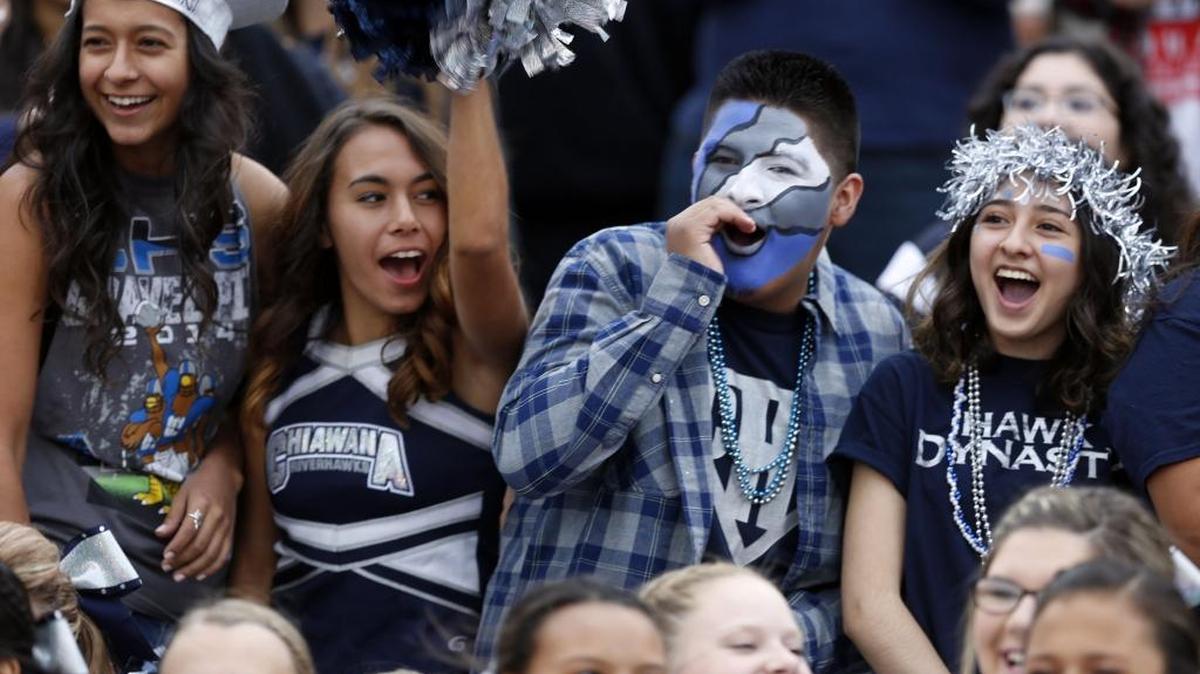 
Chiawana High School seniors, from right, Marbella Contreras, Jose Villanueva, Justice Aragon and Elisabeth Torres cheer Friday during the football game against Camas at Edgar Brown Memorial Stadium in Pasco. See more photos at www.tricityherald.com.
