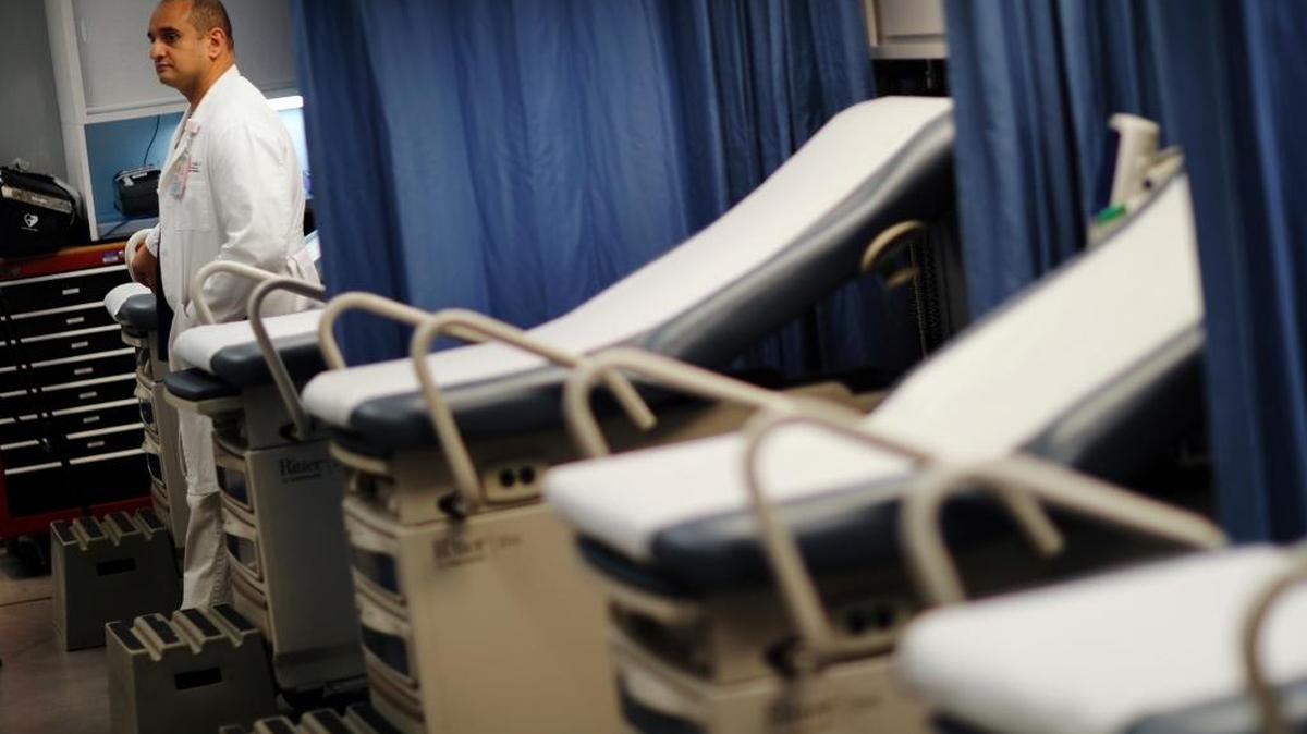 In this January photo, Dr. Hany Atallah stands inside a mobile emergency room set up outside Grady Memorial Hospital in Atlanta to help handle the ever-growing number of flu cases.
