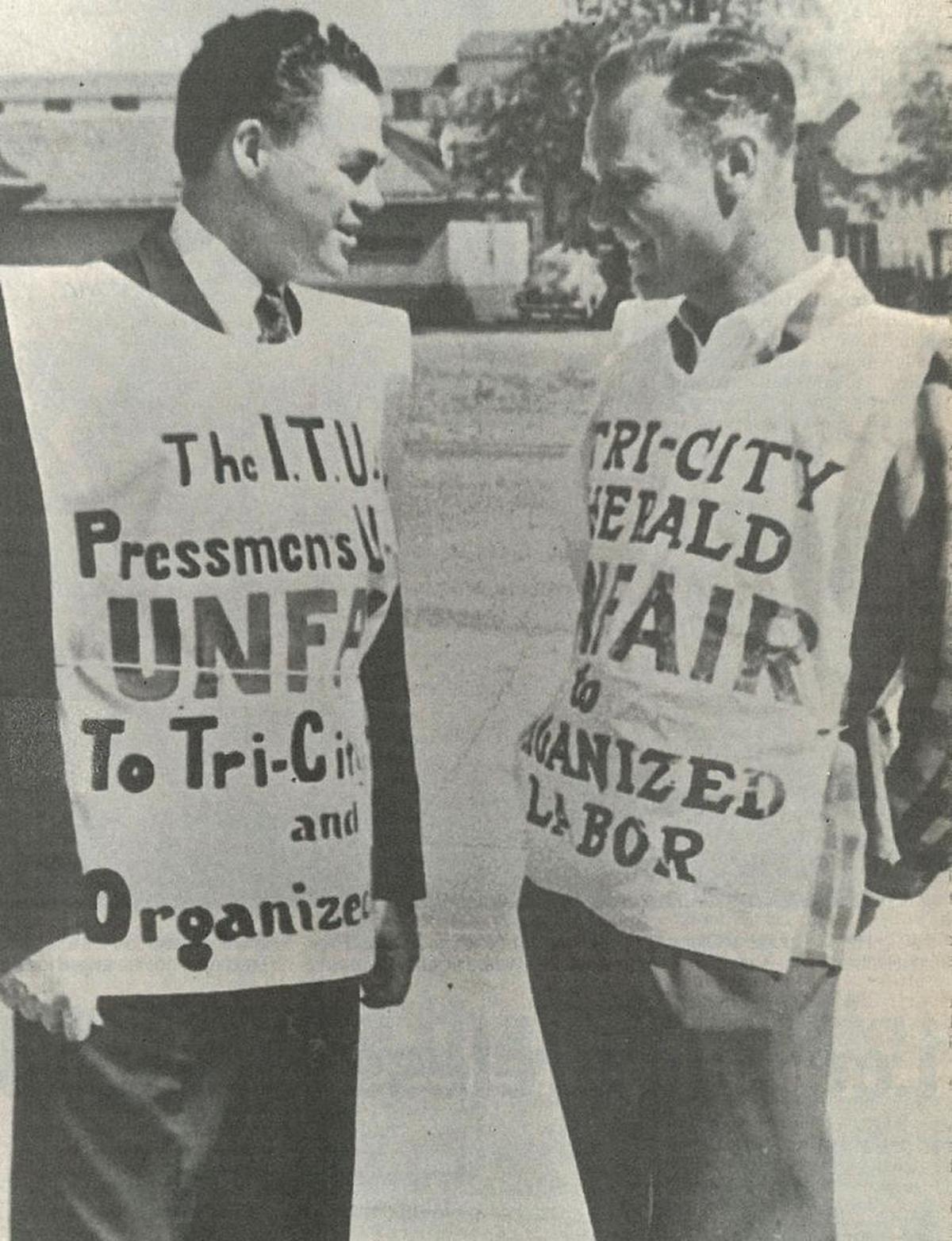 Herald publisher Glenn C. Lee pickets the pickets during the jovial beginning of the printers strike in 1950. The strike, however, turned bitter as union supporters stoned the Herald, spread nails in the parking lot and followed carriers. The dispute led to battles in the street and in the courtroom.
