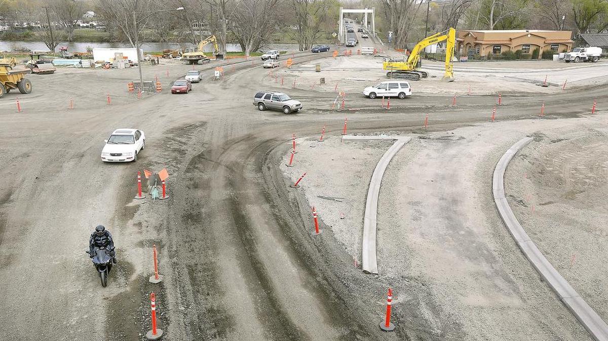 Motorists make their way through the construction zone Monday for the new traffic roundabout being built at the Benton City interchange near Interstate 82. The new $4.5 million roundabout ties together highways 224 and 225. It is the first construction project under the $16 billion transportation package the Legislature passed last year. The work is expected to be finished later this year.