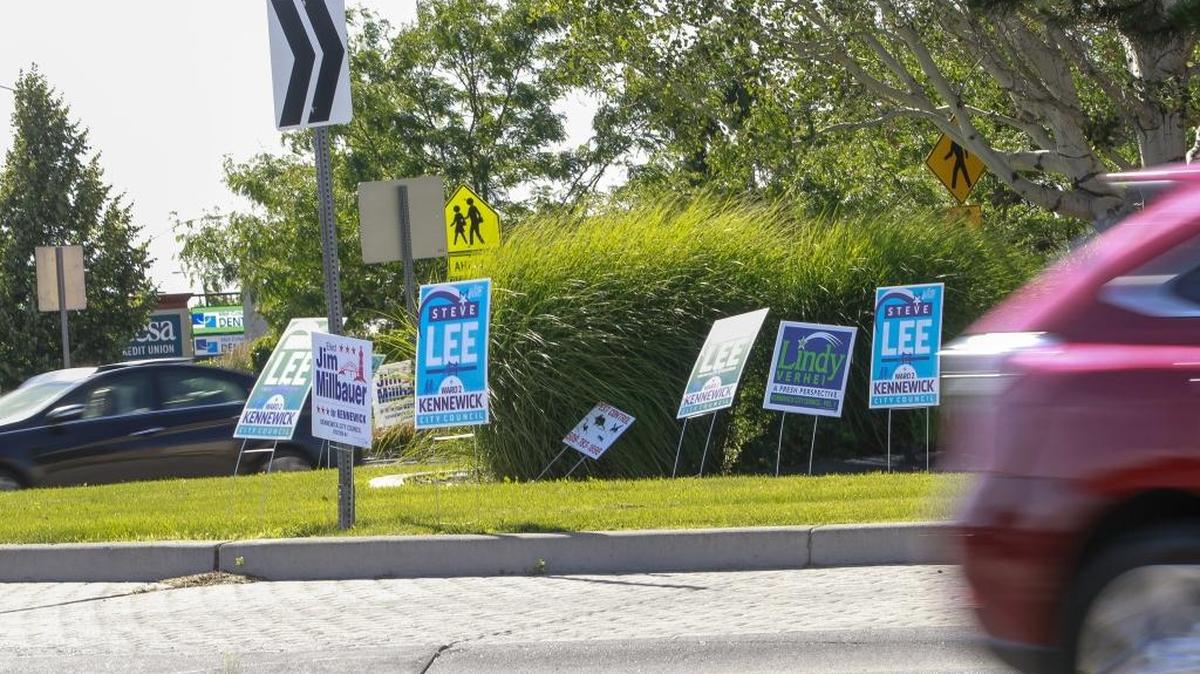 Campaign signs line the roundabout at 27th Avenue and Union Street in Kennewick. Signs aren’t allowed on public property in Kennewick. The city is notifying candidates about the rule and will remove any not taken down.