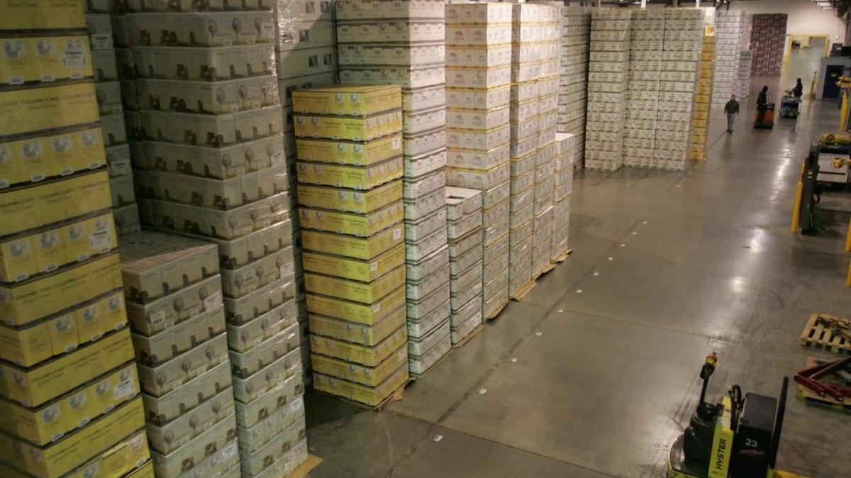 Railex Wine Services is investing $10 million to expand its Wallula Wine warehouse to 760,000 square feet by spring 2017. Above, a Railex employee inspects cases of wine stored at the facility.