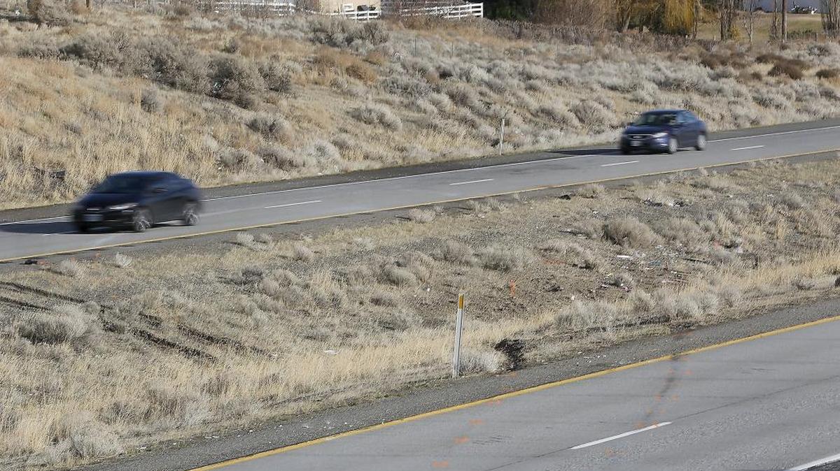 Orange paint from police investigators outlines the skid marks in the eastbound lanes of Interstate 82 Wednesday at the site of Tuesday night’s fatal collision just west of the exit for Clearwater Avenue and Badger Road.