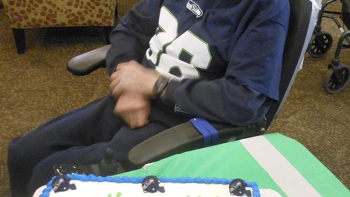 Hal Kniveton celebrates his 100th birthday at a Seahawks-themed party Dec. 27 at Hawthorne Court Retirement Community in Kennewick. His birthday was the day prior, but since he is such a big fan of the Seahawks, he had his party during the Sunday football game.