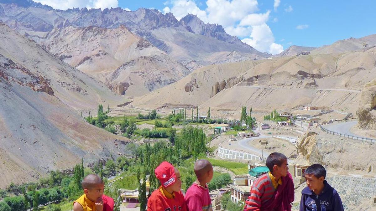 
Monklets catch some sunshine between lessons at Lamayuru Monastery in the region of Ladakh in Indian Tibet.
