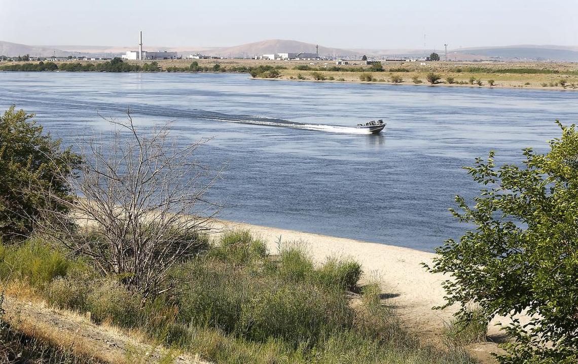 A fishing boat speeds past the site on Columbia River known as Carbody Beach  Monday morning in rural Franklin County where the remains of Michelle Hudnall were discovered. 