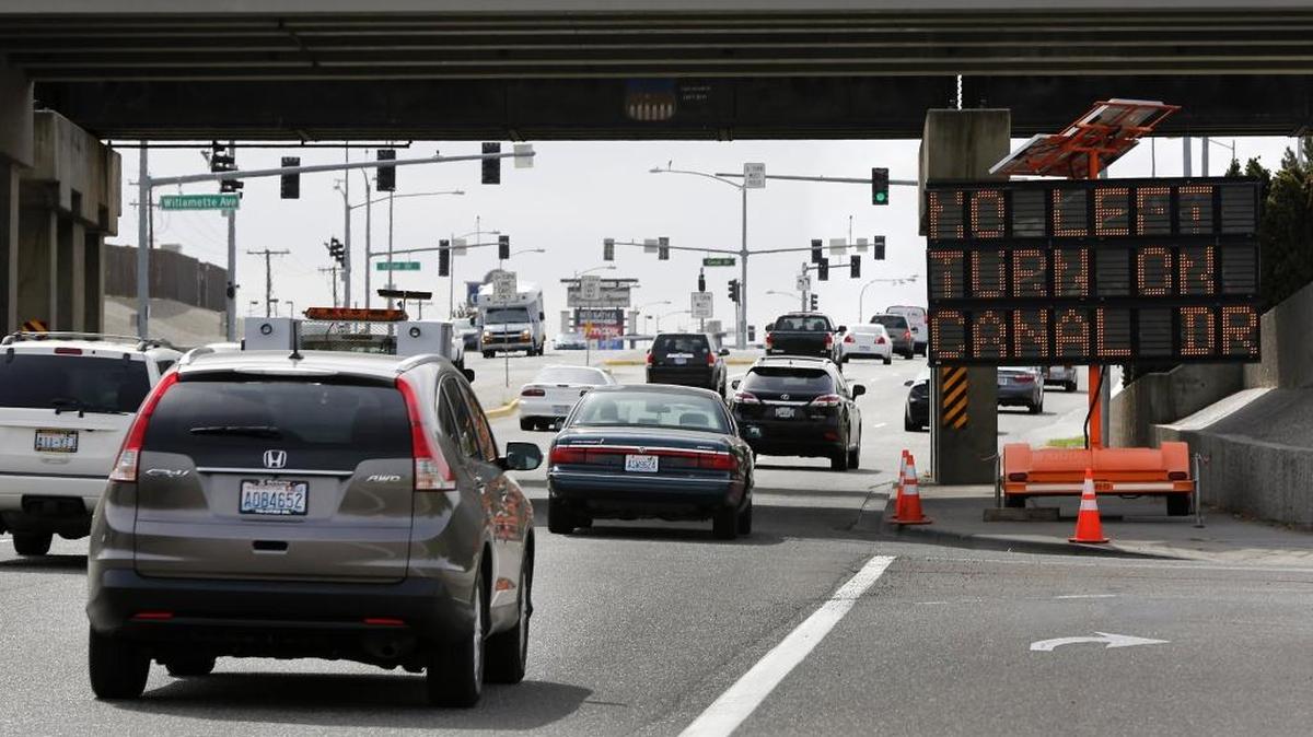 
A road construction message board warns motorists Tuesday morning of traffic congestion and lane closures at the intersection of Columbia Center Boulevard and West Canal Drive in Kennewick. Repairs have been completed to the damaged traffic signal control box.
