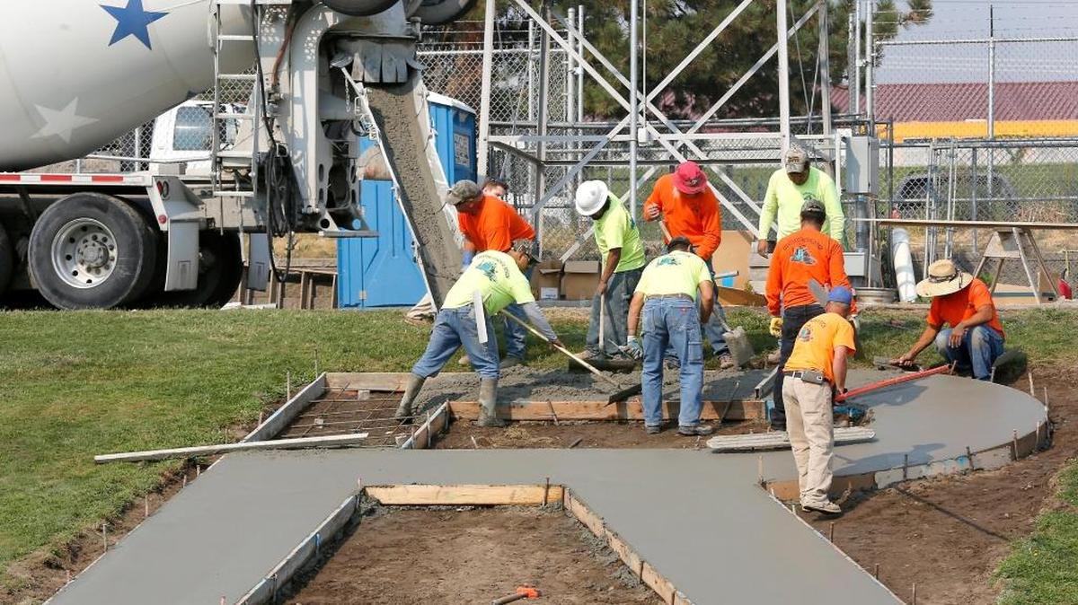 
A crew works in mid-August pouring concrete for the replacement letter “R,” for Richland High School at Fran Rish Stadium in Richland. The Richland School Board will consider options Oct. 13 for replacing the “C” at Carmichael Middle School. It was removed in early 2014 amid public outcry along with an “R” and “H,” representing Richland and Hanford high schools.
