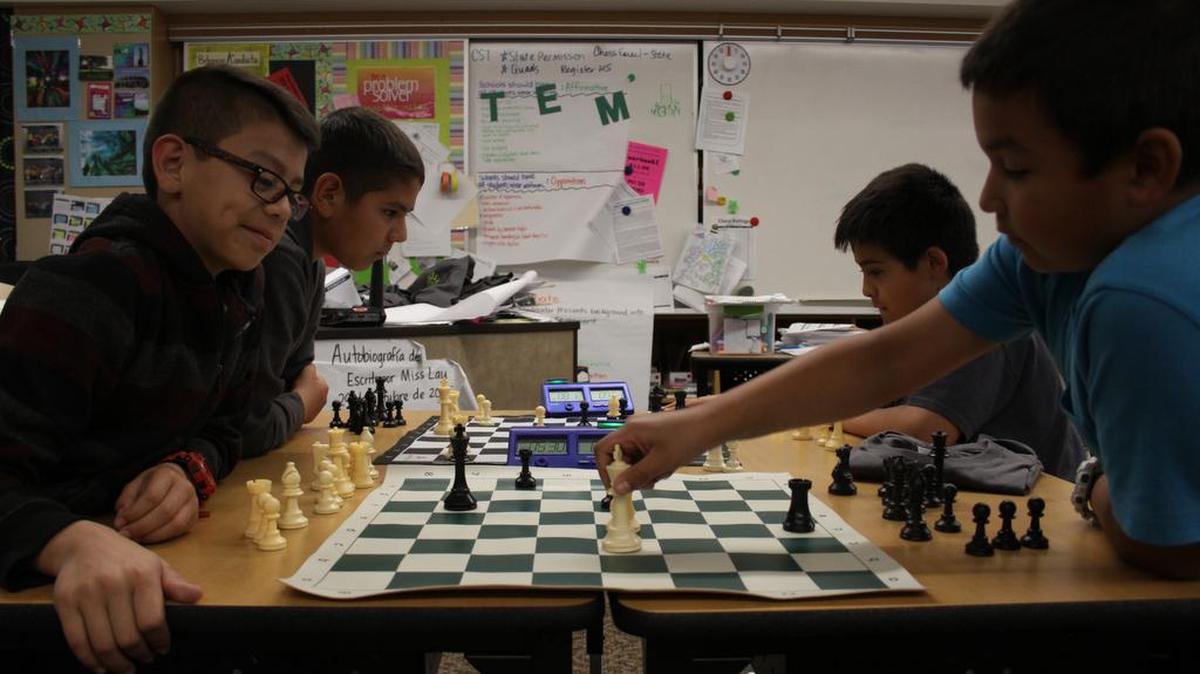 Fourth-grader Daniel Jimenez, left foreground, watches fellow fourth-grader Steven Perez make a move during a practice match Tuesday at Pasco’s Marie Curie STEM Elementary School. Nineteen students at Curie were among about 150 students from the Tri-Cities who qualified for this year’s state chess championship in Tacoma.