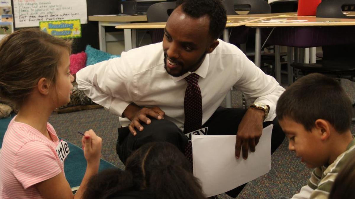 Dahir Jigre listens to a question from one of his first-grade students at Connell Elementary School.