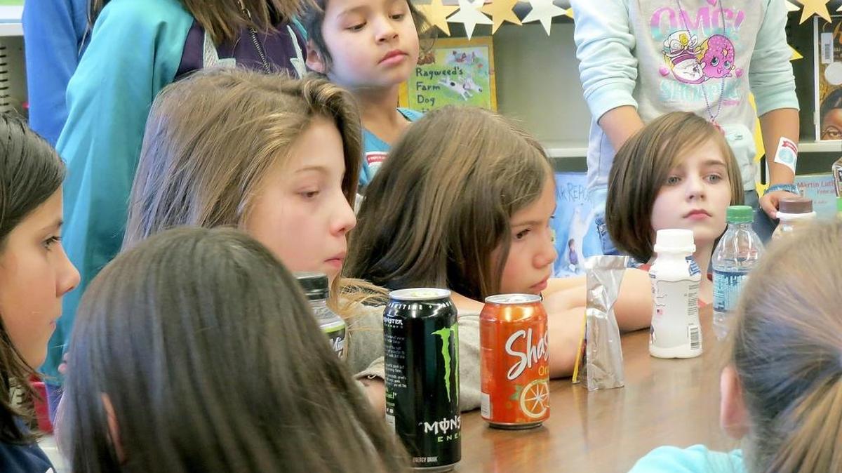 Jefferson Elementary School students in Richland learn about the amount of sugar in drinks as part of Kadlec Academy, a four-week program to learn about healthy eating, exercise and simple first aid techniques.