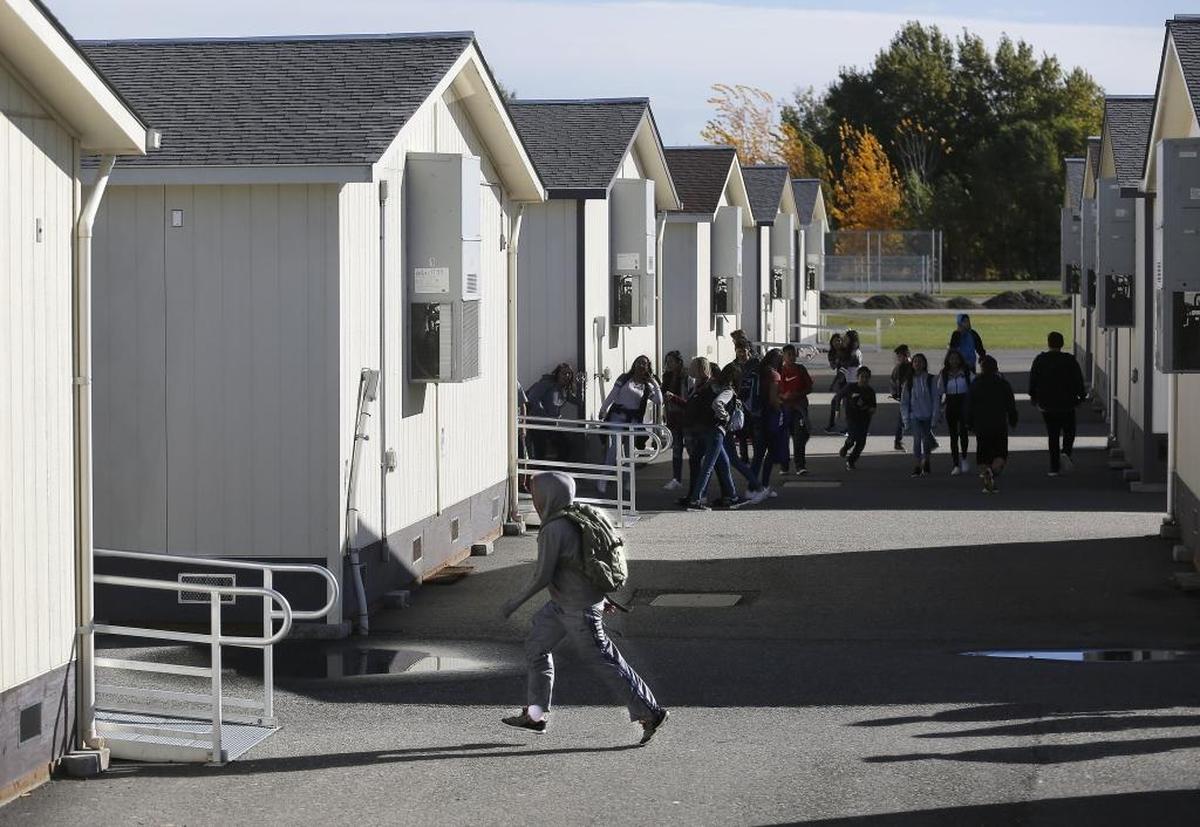 The Washington Legislature went into overtime sessions this year to approve a plan to increase spending on K-12 public schools that allocates billions in new spending over the next four years. The state Supreme Court ruled it’s not enough yet. Pictured are some of the 30 portable classrooms at McLoughlin Middle School in Pasco.