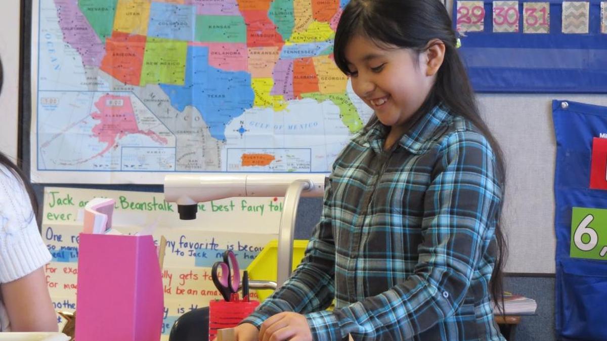 Third-grade student Mariana Zacarias plays with blocks Friday during recess.