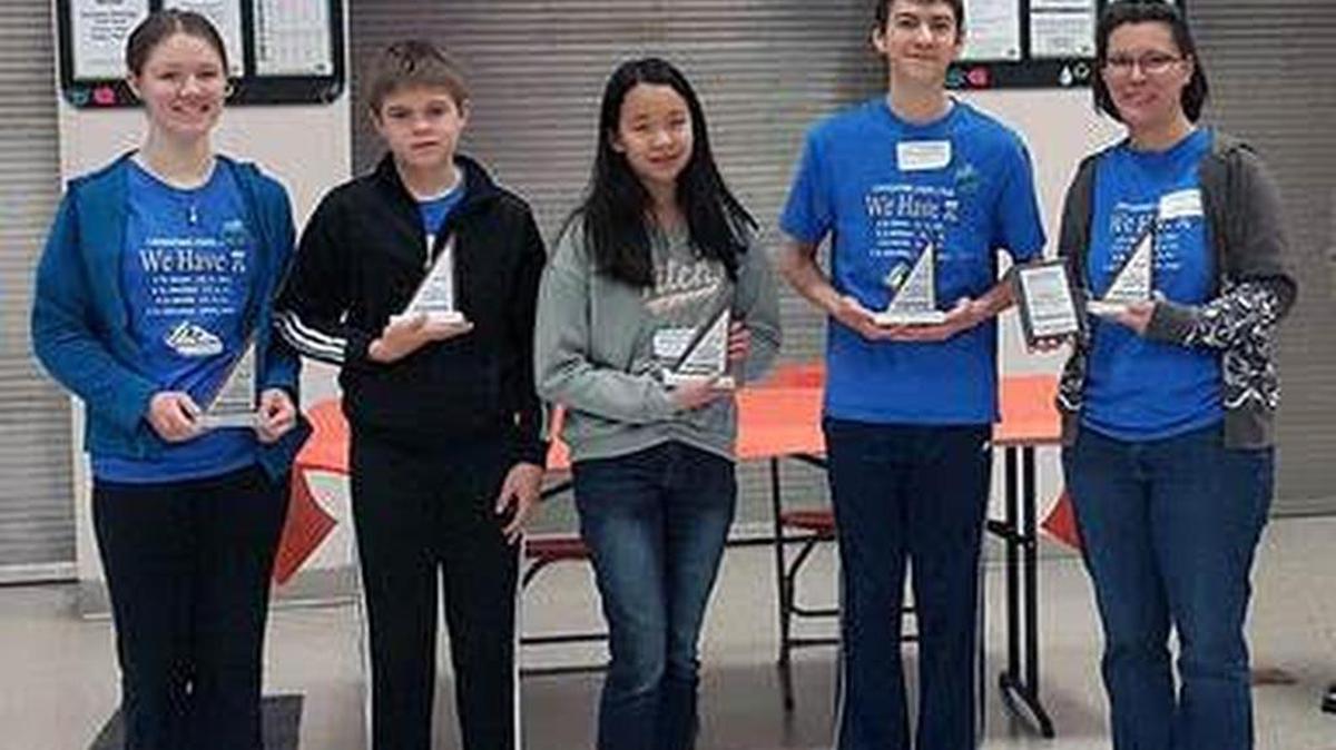 From left, Zoe Gotthold, Johnnie Norsworthy, Trisha Boonpongmanee, John Titus Barnett and coach Michelle Gotthold earned first place at the local Math Counts competition.