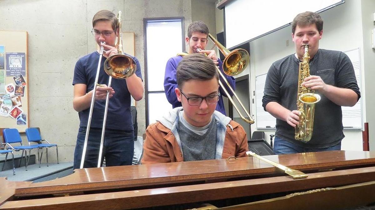 Elijah Hyatt, left, Andrew Lanning and Collin Iedema practice with Gavin Allen-Dunn on the piano in a Columbia Basin College classroom. The four high school students are heading to Bellevue this weekend to play in the All-Northwest Jazz Band.