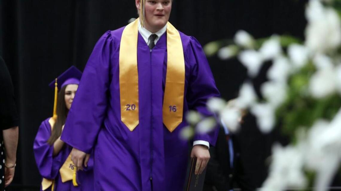 Hanford High senior who beat cancer walks with his class
